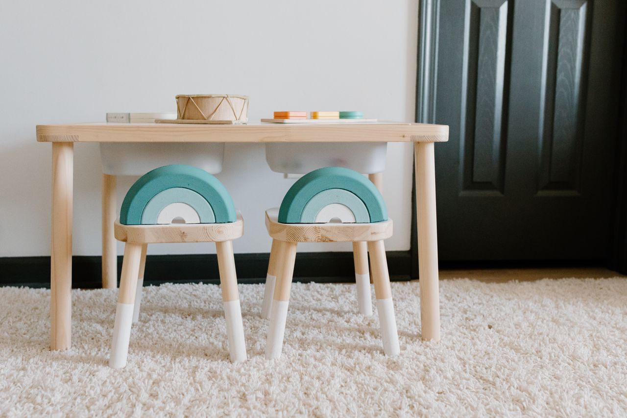 Home Bright playroom featuring wooden furniture and educational toys for children. Ideal for sustainable learning.