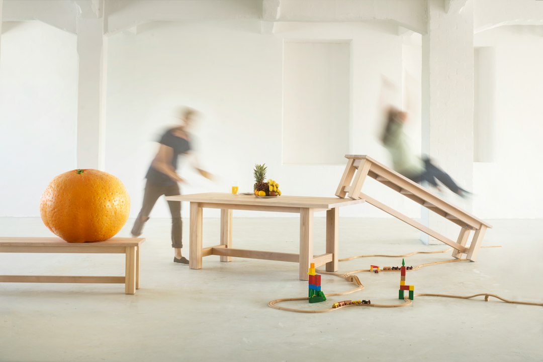 A photo shooting in an industrial building of an solid wood table in a family scene.